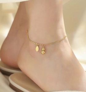 Exquisite 18K gold-plated anklet featuring a hollow gourd pendant and engraved lucky charm