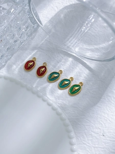 Detailed macro view of five colorful seashell charms for DIY jewelry accessories