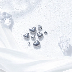 Polished heart-shaped stainless steel beads in various sizes for DIY jewelry crafting