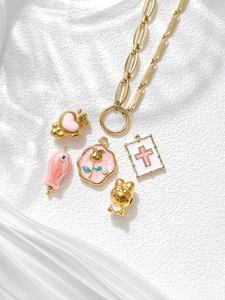Detailed set of gold metal chains and pink enamel pendants for DIY jewelry making