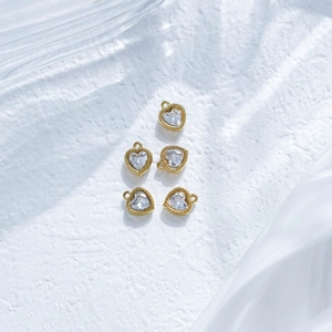 Five gold-plated heart charms with cubic zirconia stones for DIY jewelry making