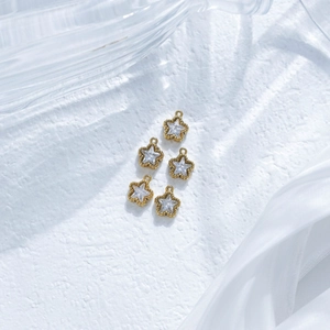 Golden stainless steel star pendants with clear zircon inlay and beaded edge details