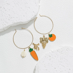 Golden hoop earrings with creative enamel carrot, grape and pearl charms on white stone