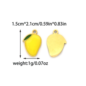 Detail of yellow enamel mango pendants with green leaves and gold metal plating