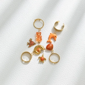 Marine life themed jewelry set with orange resin dolphin, bear and shell pendants