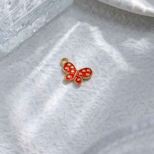 Red enamel butterfly pendant with gold dots and metal ring for DIY jewelry making