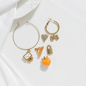 Golden stainless steel earring set with enamel heart, bow and headphone charms
