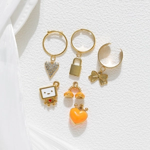 Gold stainless steel jewelry set featuring heart, bow, and robot pendants with enamel
