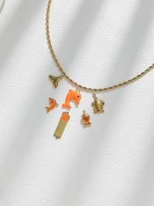 Golden rope chain necklace with ocean-themed dolphin and turtle orange enamel charms