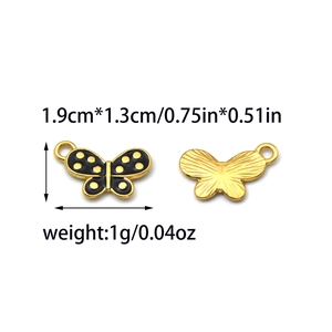 Detail of black enamel butterfly charm with gold dots for DIY jewelry making 1.9x1.3cm