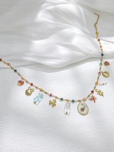 Golden ball chain necklace with diverse charms like heart, bunny, bear and chili pendant