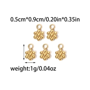Macro shot of 18K gold gourd-shaped pendants showing size 0.5cm by 0.9cm for DIY jewelry