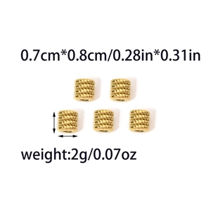 Detailed view of golden spiral spacer beads with precise size and weight measurements