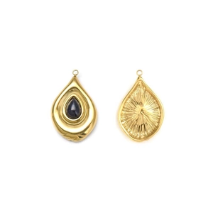 Detail showing gold teardrop pendant with dark gemstone and sunburst texture back