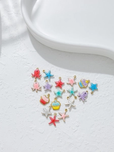 Macro detail of colorful enamel marine life and cupcake charms for DIY jewelry making