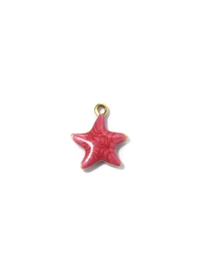 Macro shot of pink enamel starfish pendant with golden metal bail for DIY jewelry