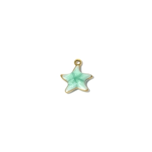 Macro shot of mint green enamel starfish pendant with gold-plated metal edges for DIY