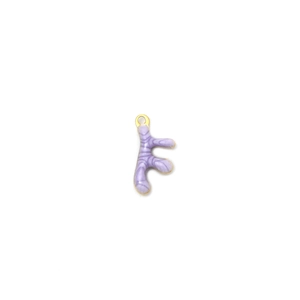 Close-up of a lavender enamel crab-shaped pendant with a gold metal border and loop