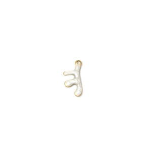 Close-up of golden abstract organic branch pendant with white enamel filling for DIY jewelry