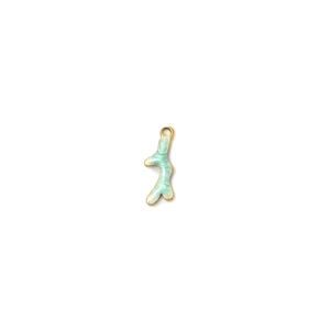 Macro detail of gold-plated coral pendant with mint green enamel inlay for jewelry making