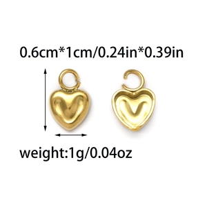 Macro detail of gold heart pendants showing solid and hollow designs with dimensions