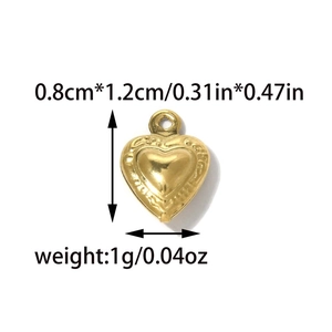 Detail of 0.8x1.2cm gold bohemian heart pendant showing size and embossed pattern