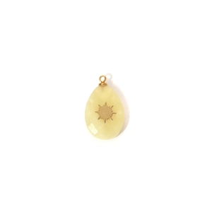 Faceted yellow stone teardrop pendant with golden sunburst inlay and top bail