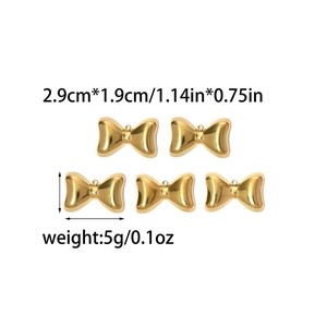 Detailed view of gold bow-shaped metal pendants with 2.9cm x 1.9cm size and 5g weight data
