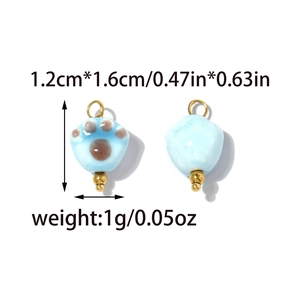 Cat paw ceramic pendant set in light blue with size measurements and gold metal ring