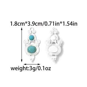 Detail view of bird-shaped western pendant with turquoise inlay and ornate metalwork