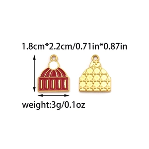 Detail of enamel Christmas charms with gold engraving and dimensions 1.8cm x 2.2cm