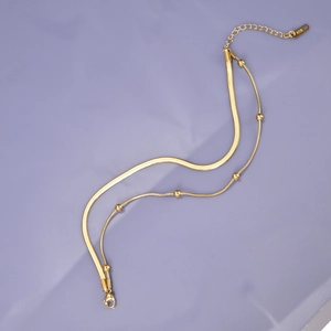 Tobillera de doble capa bañada en oro de 18K con cuentas y cadena de hojas para mujer