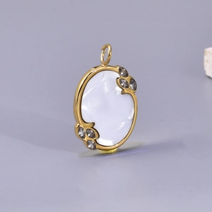 Oval stainless steel shell pendant with 18K gold finish and leaf-shaped stone accents