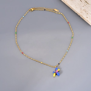 Golden beaded necklace featuring a 3D colorful balloon dog pendant and tiny vibrant beads