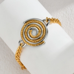 Two-tone gold and silver spiral disc charm bracelet with elegant Cuban link chain