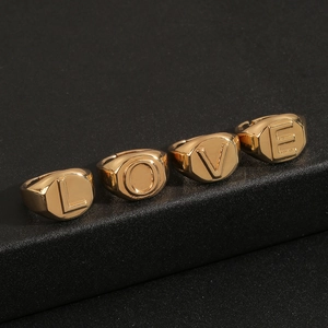 Set of four 18K gold plated signet rings featuring LOVE letter engravings