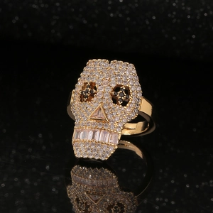 Hip hop skull ring with gold plating and paved sparkling cubic zirconia gemstones
