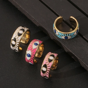 Adjustable evil eye rings in white, pink, and blue with gold plated oil drip finish