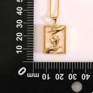 Detailed view of gold rectangle pendant measuring 30mm height on a box chain