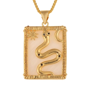 Detail view of gold snake pendant with star and moon charms on shell inlay necklace