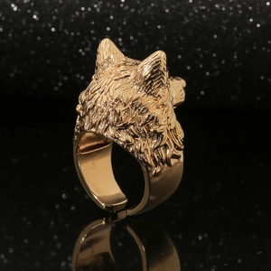 Detailed view of golden wolf head ring with intricate textures and adjustable band