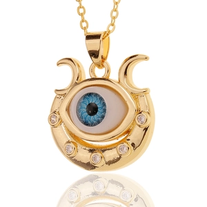 Gold plated evil eye crescent necklace with white crystal accents and thin chain link