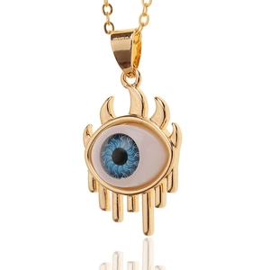 Golden Evil Eye pendant necklace with blue radiating eye detail and sleek flame frame