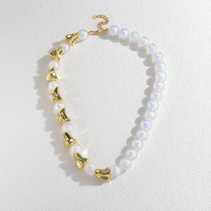 Exaggerated stainless steel necklace featuring holographic beads and golden geometric pieces