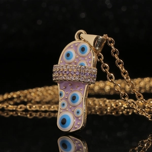 Gouden slippers hanger ketting met roze emaille boze oog patroon en ingelegde kristallen