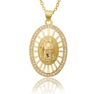 Detailed macro view of gold-plated St. Jude pendant with micro-pave cubic zirconia crystals