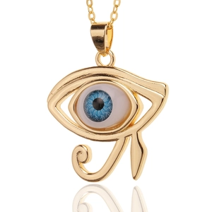 Close-up of gold plated Eye of Horus pendant necklace with realistic blue evil eye inlay