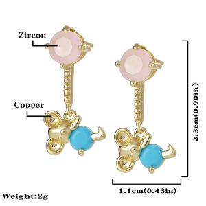 Detail of copper gold plated bear earrings with pink zircon and blue gemstone charms