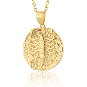 Detailed view of Scorpio zodiac round pendant in 18K gold plating with hammered texture