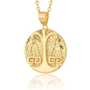18K gold plated Libra zodiac pendant necklace with vintage textured disc on a white background